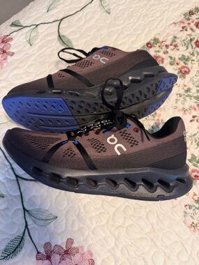 On Running Women’s Cloudmonster Sneakers in Charcoal Gray with Blue Accents